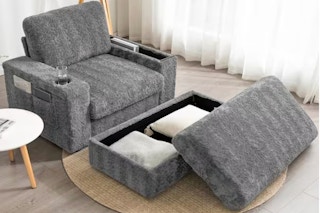 Lifestyle image of a gray faux rabbit fur oversized chaise lounge with storage ottoman in home setting