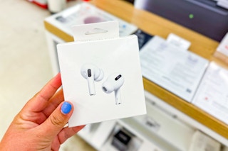 person holding airpods