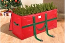 A red and green zipper bag with handles measures 7.5 feet long, large enough to hold a tree.