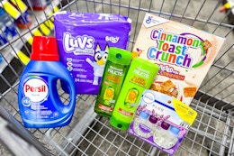 persil detergent, luvs diapers, garnier shampoo, febreze refills, and cinnamon toast crunch cereal in a cart