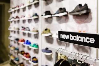 New Balance athletic shoes on a sports shop counter