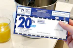 someone holding a bed bath & beyond coupon