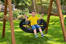 Lifestyle image of small child on Batman Saucer Swing outdoors