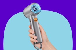 Person holding a handheld fan.