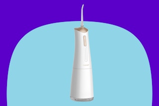 Cordless Electric Water Dental Flosser on a blue background.