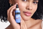 Woman holding Neutrogena Serum