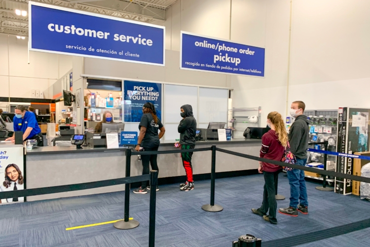 People waiting in line for the Best Buy customer service counter.