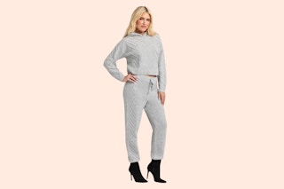 Model wearing the gray Jessica Simpson Sweater Outfit Set (complete with a sweater and matching pair of joggers)