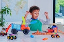 Lifestyle image of child playing with the Hot Wheels Monster Trucks Arena Playset 