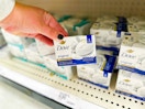 hand holding a pack of dove bar soap in front of target shelf