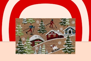 doormat with skiing people and houses