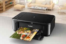 a printer printing a picture on a table