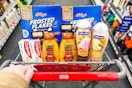 frosted flakes, toothpaste, body wash, shampoo, and eyeshadow in a cart
