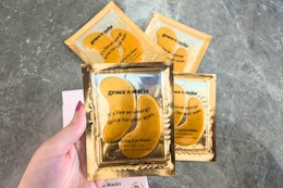 a pack of gold grace & stella under-eye masks on a table
