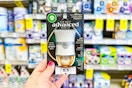 person holding an air wick advanced oil warmer