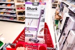 hand pushing shark-pet-cordless-vacuum in target cart