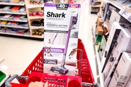hand pushing shark-pet-cordless-vacuum in target cart