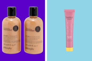 A set of two Philosophy shower gels next to a single Butter London hand and foot cream on a purple and blue background. 