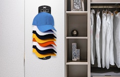 a hat organizer on a wall of a closet