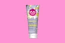 an eos hand cream on a pink background
