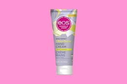 an eos hand cream on a pink background