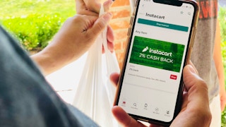 Person using Instacart and receiving their order from a delivery person.