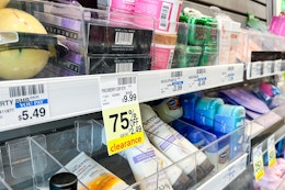 shelves at cvs with 75% off clearance signs