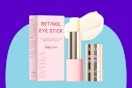 A box and a tube of retinol eye stick with the lid off and a glob of cream behind it