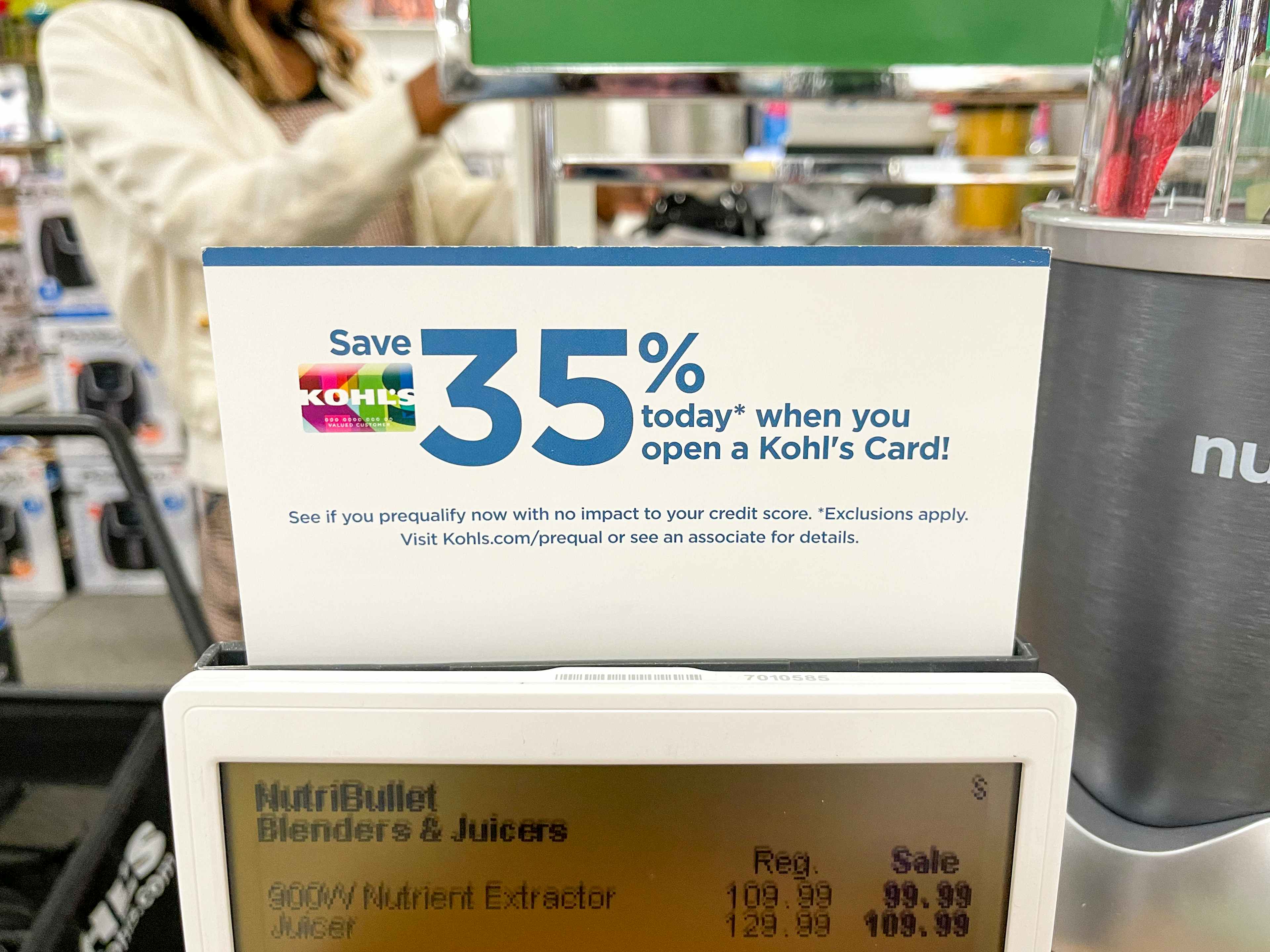 A sign indicating 35% off your first purchase with the Kohl's credit card.