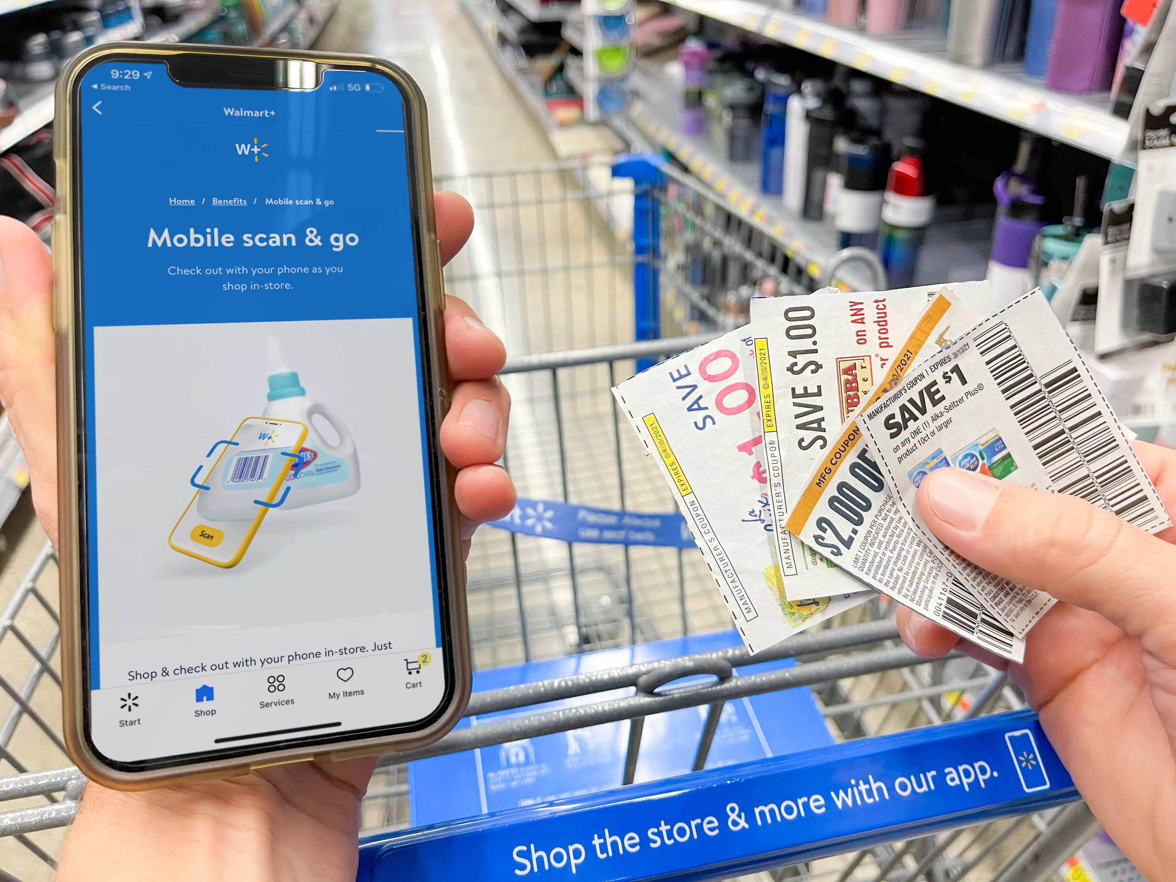 A person holding a phone with the Walmart app open, surrounded by coupons and shopping lists