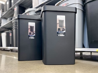 mainstays motion-sensor trash can sitting on the floor at walmart