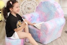 child sitting and coloring on sofa set