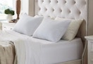 two king pillows on a bed