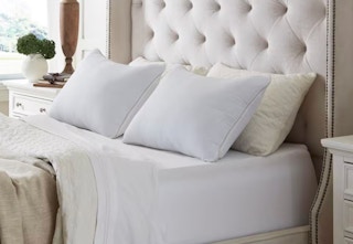 two king pillows on a bed