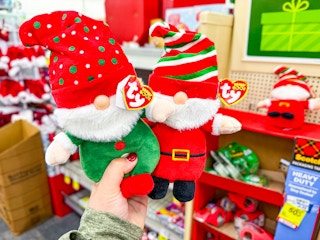 hand holding 2 ty christmas beanie boos plushes