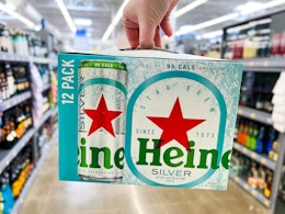 hand holding heineken silver beer