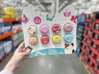 hand holding a pack of squishmallows lip balm