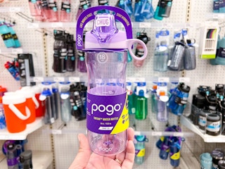 hand holding a purple pogo tritan chug water bottle at target