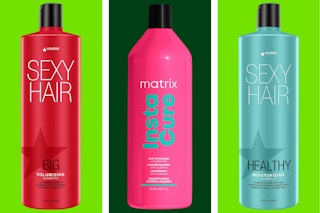 A variety of shampoos and conditioners on a dark and light green background. 