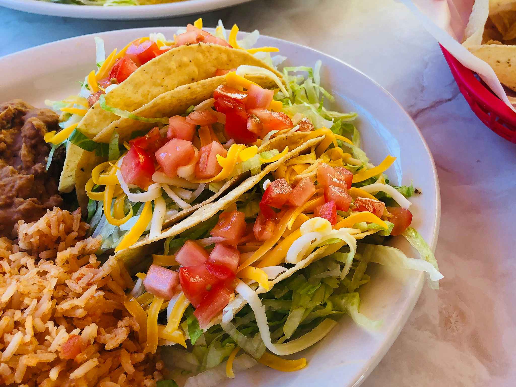 Tacos from Chuy's on a plate.