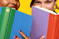 Lifestyle image of 2 people with books up to their face