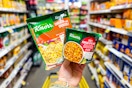 hand holding knorr sides and knorr cup