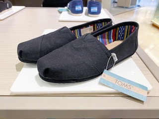 toms shoes sitting on a display
