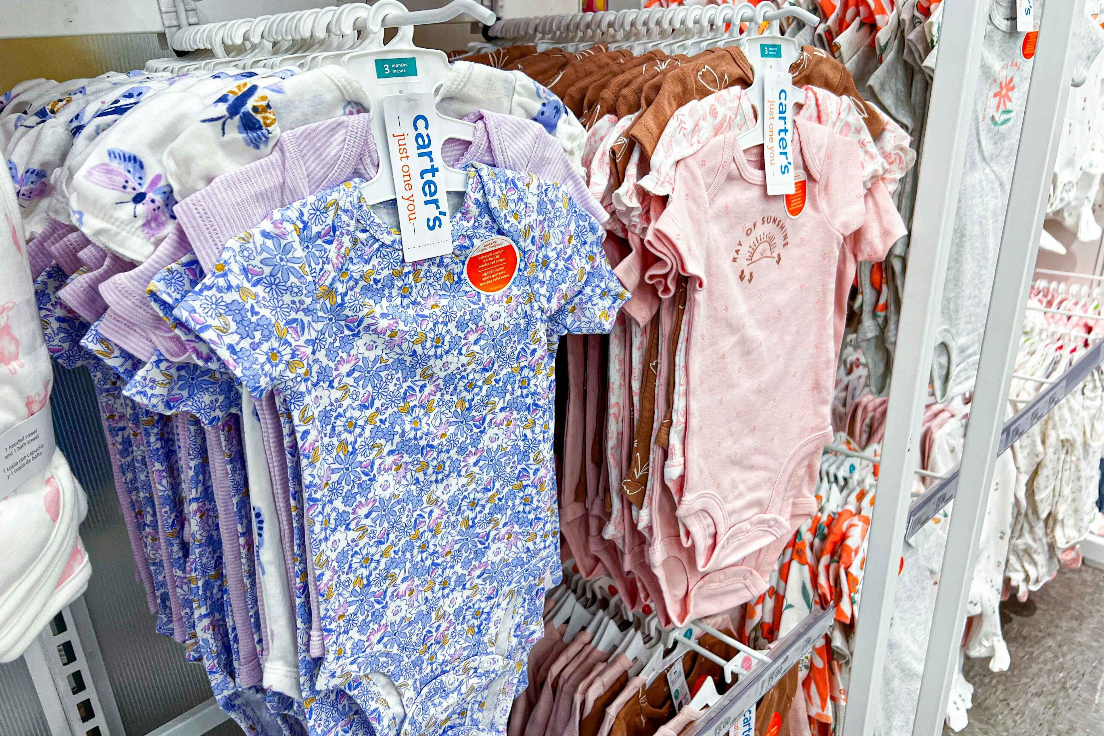 carter's baby bodysuits 3-pack sitting on a target shelf