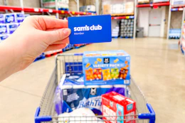 hand holding a sams club membership card