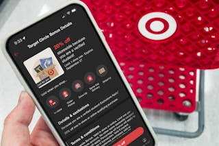 someone holding a phone showing a student offer at target