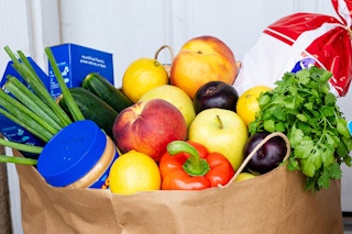 a paper bag full of groceries