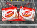 two packs of boost nutrition shakes in a shopping cart