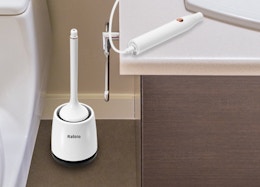 an electric toilet brush in a bathroom 