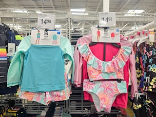 matching kids swimwear sets hanging up on display
